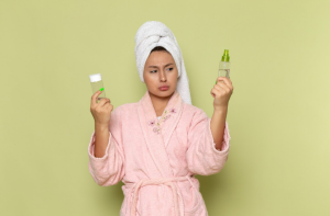 A woman choosing between two glycolic acid products