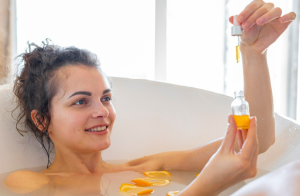 A woman in a tub using glycolic acid