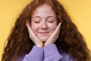 A girl feeling happy of the result after using glycolic acid