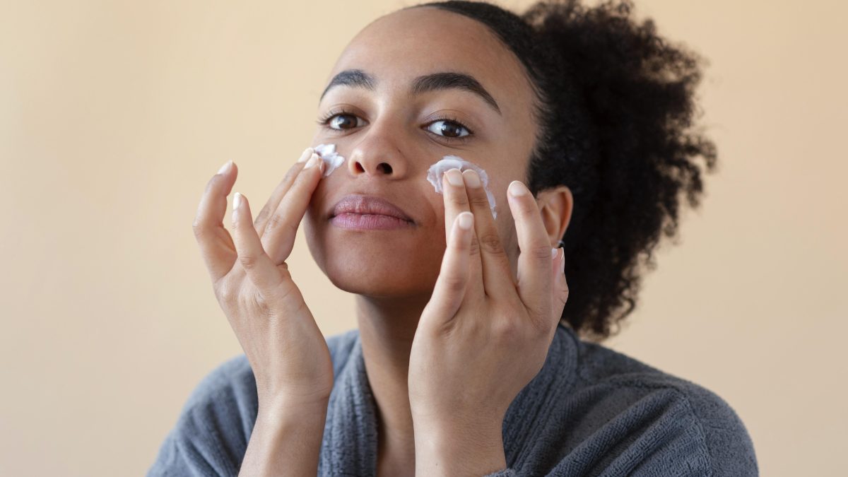 A woman applying cream with salicylic acid