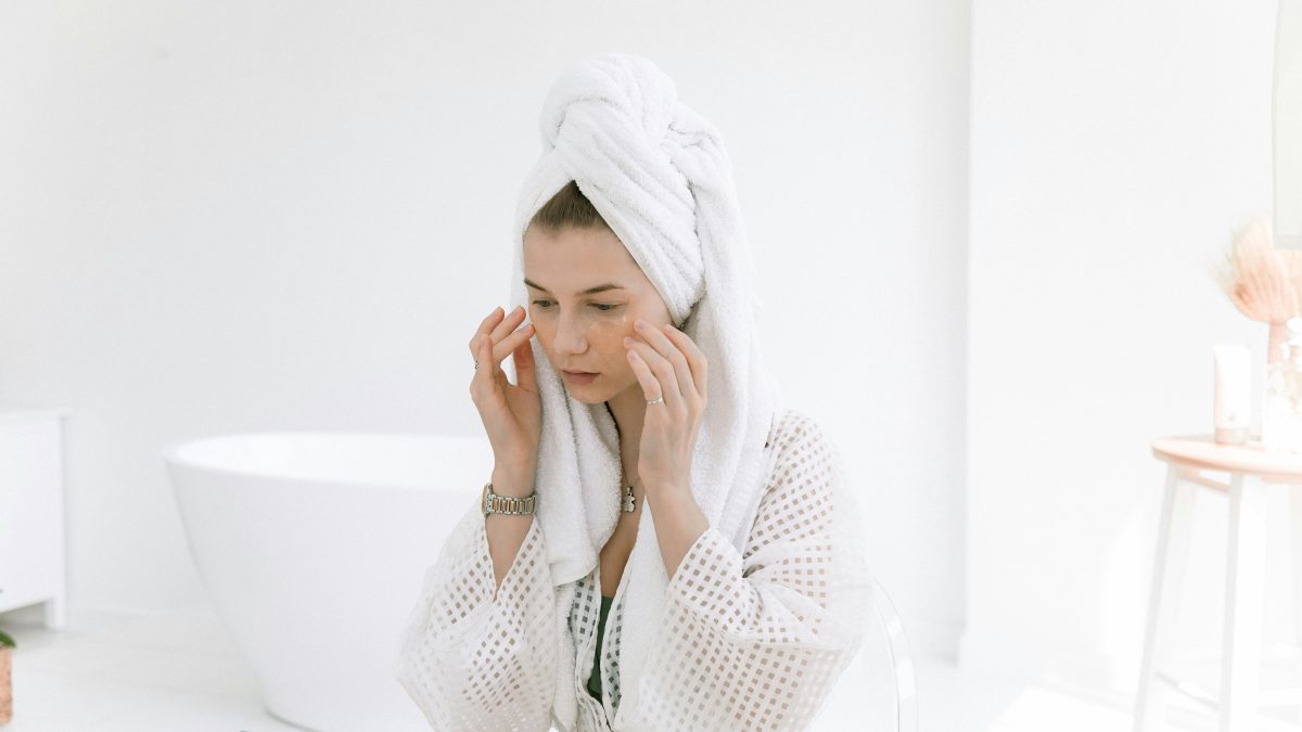 A woman applying salicylic acid on her face