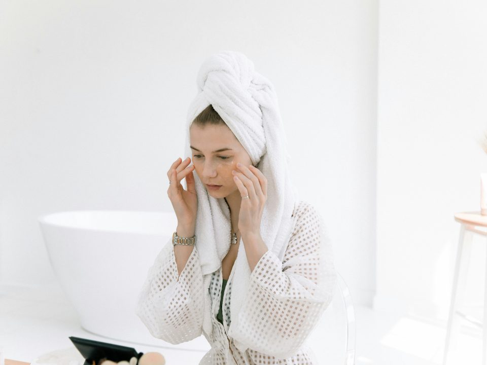 A woman applying salicylic acid on her face