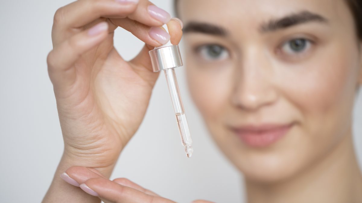 A woman using salicylic acid serum