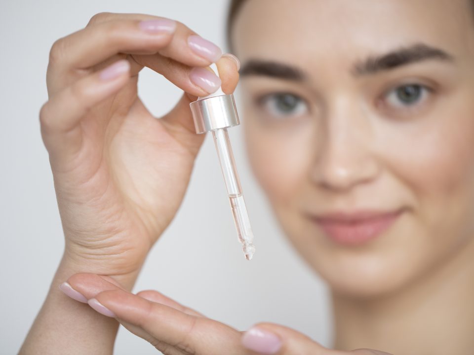 A woman using salicylic acid serum