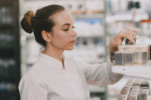 A woman carefully choosing what skin treatments to use 