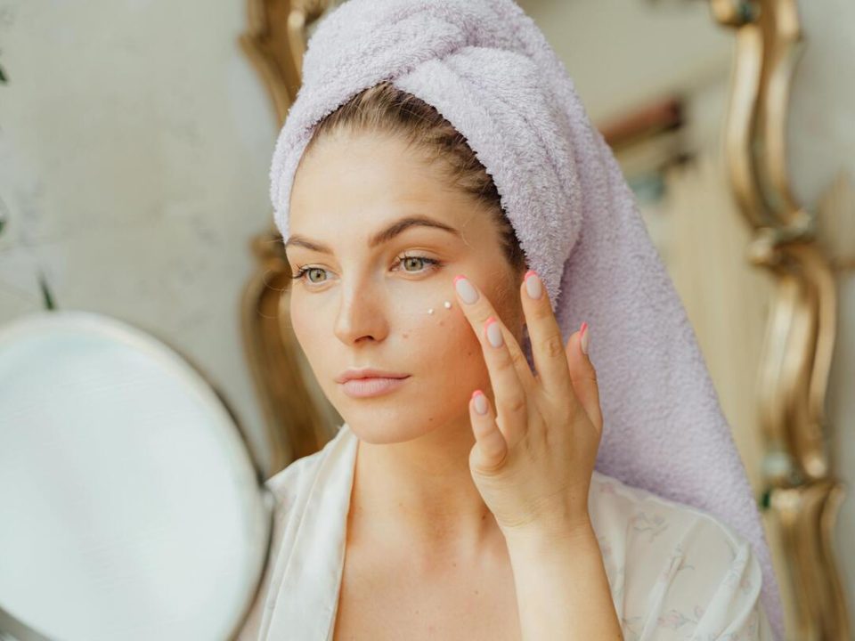A woman using a lactic acid peel to her face